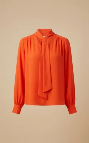 بلوز زنانه نارنجی با یقه کراواتی بلند و آستین‌های مچ‌دار نوادو کد 404112371870